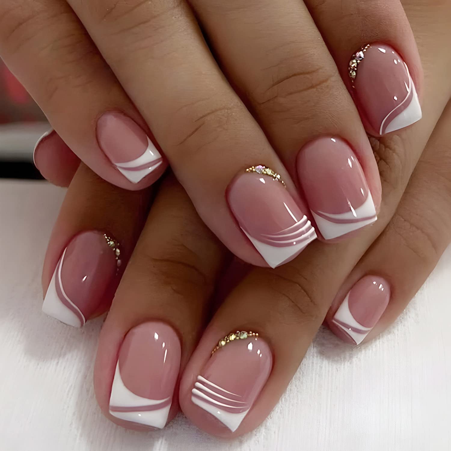 Short french nails with rhinestones | Burke Beauty LLC