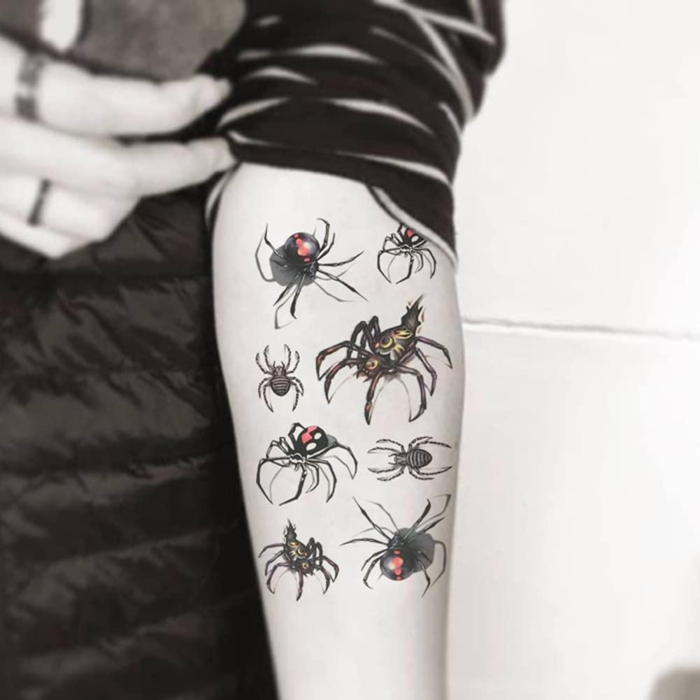 A woman's stomach with a spider tattoo on it photo – Free Skin Image on  Unsplash