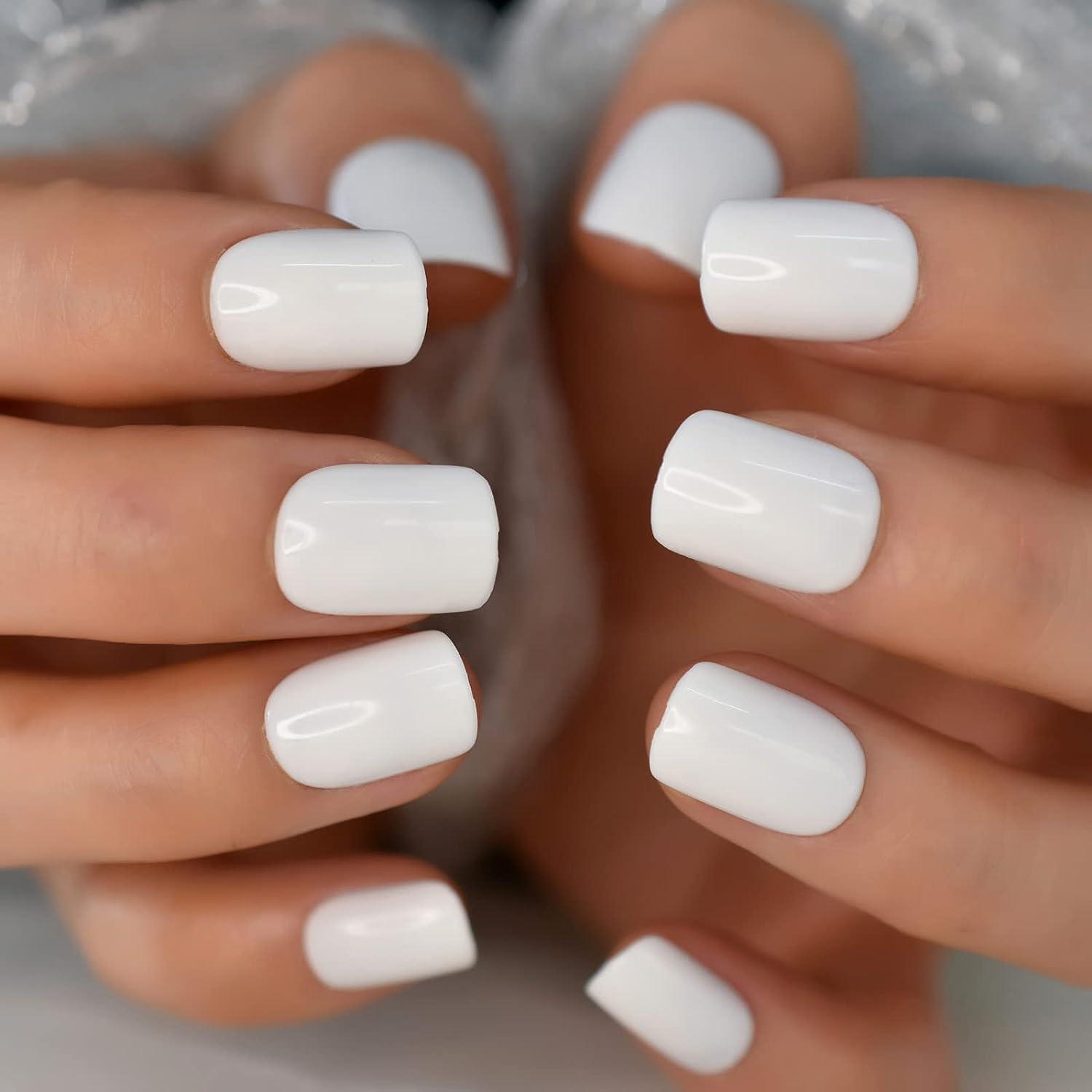 Light milky manicure on square shaped nails. Stock Photo | Adobe Stock