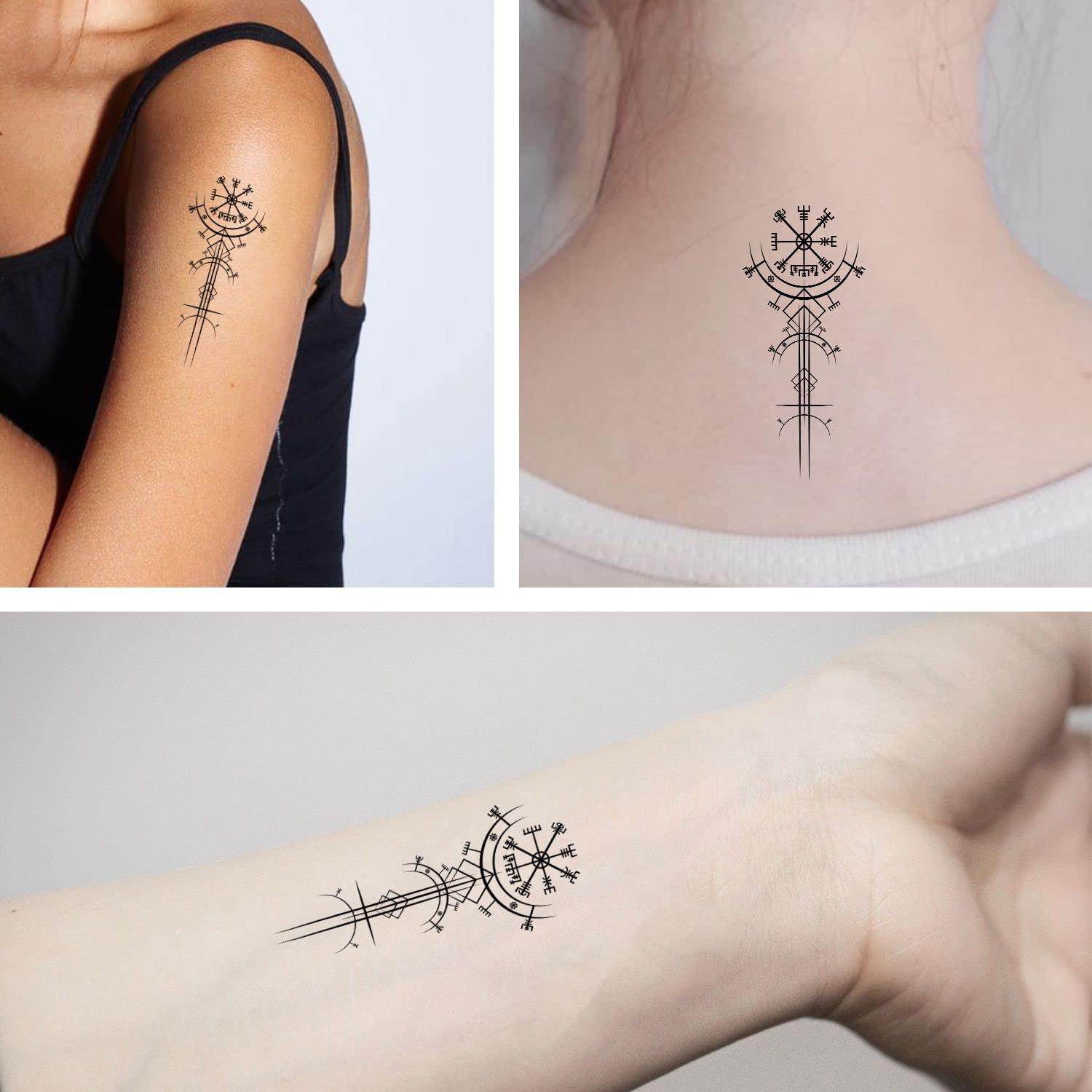 Tattoo of a compass located on the back of the neck.