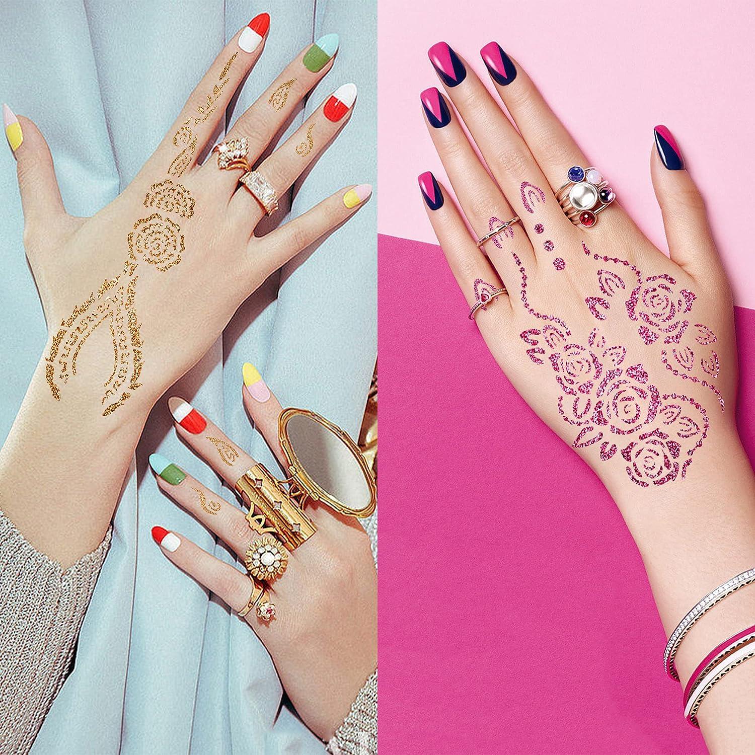 Henna Tattoo Designs On A Girl Fingers And Hand High-Res Stock Photo -  Getty Images