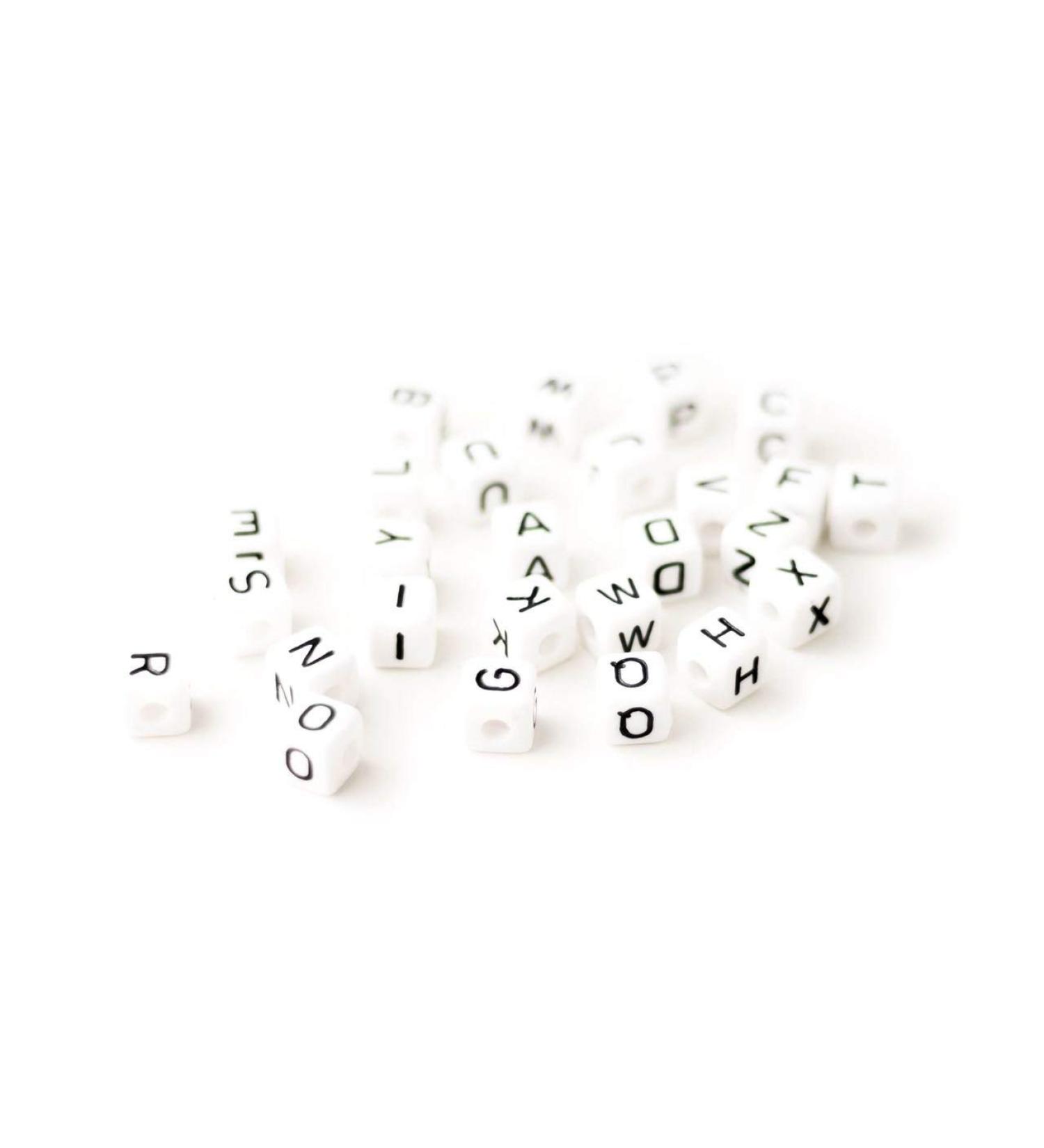 Pack of 10 white letter cubes of your choice made of 10 mm plastic suitable for pacifier chains grasping toys and much more.