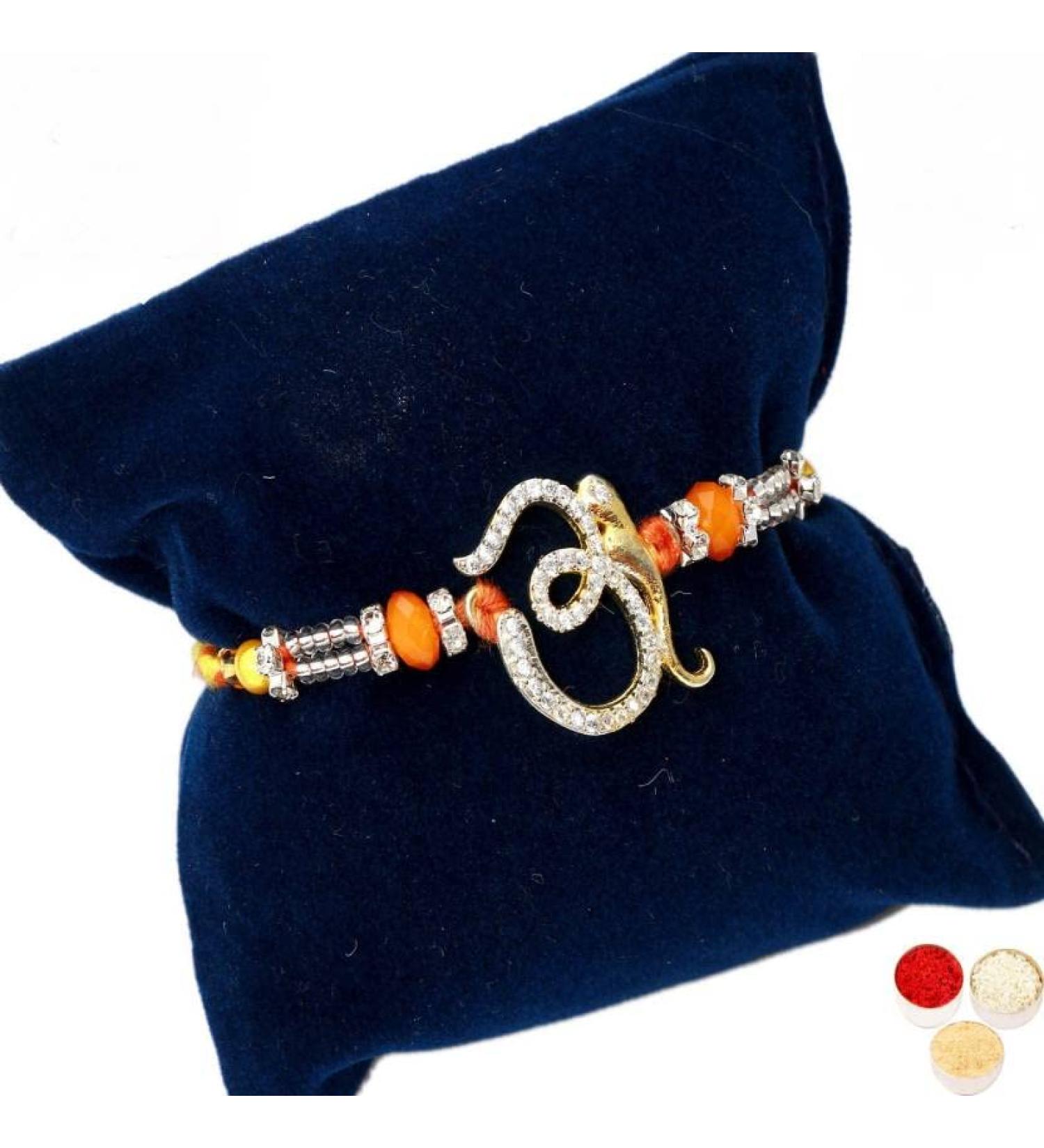 Ghasitaram Gifts Rakhi for Brother Rakhis Online - 7161 OM Viganhartha Diamond Rakhi - Buy Online on GoSupps.com