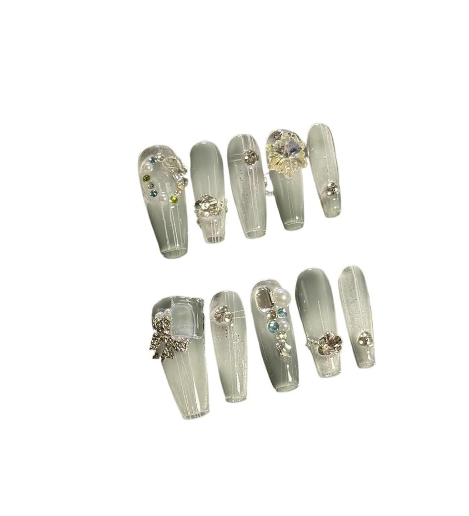 Handmade wearing of nail art patches pressing on fake nails gradually changing to medium length detachable nail art(S)