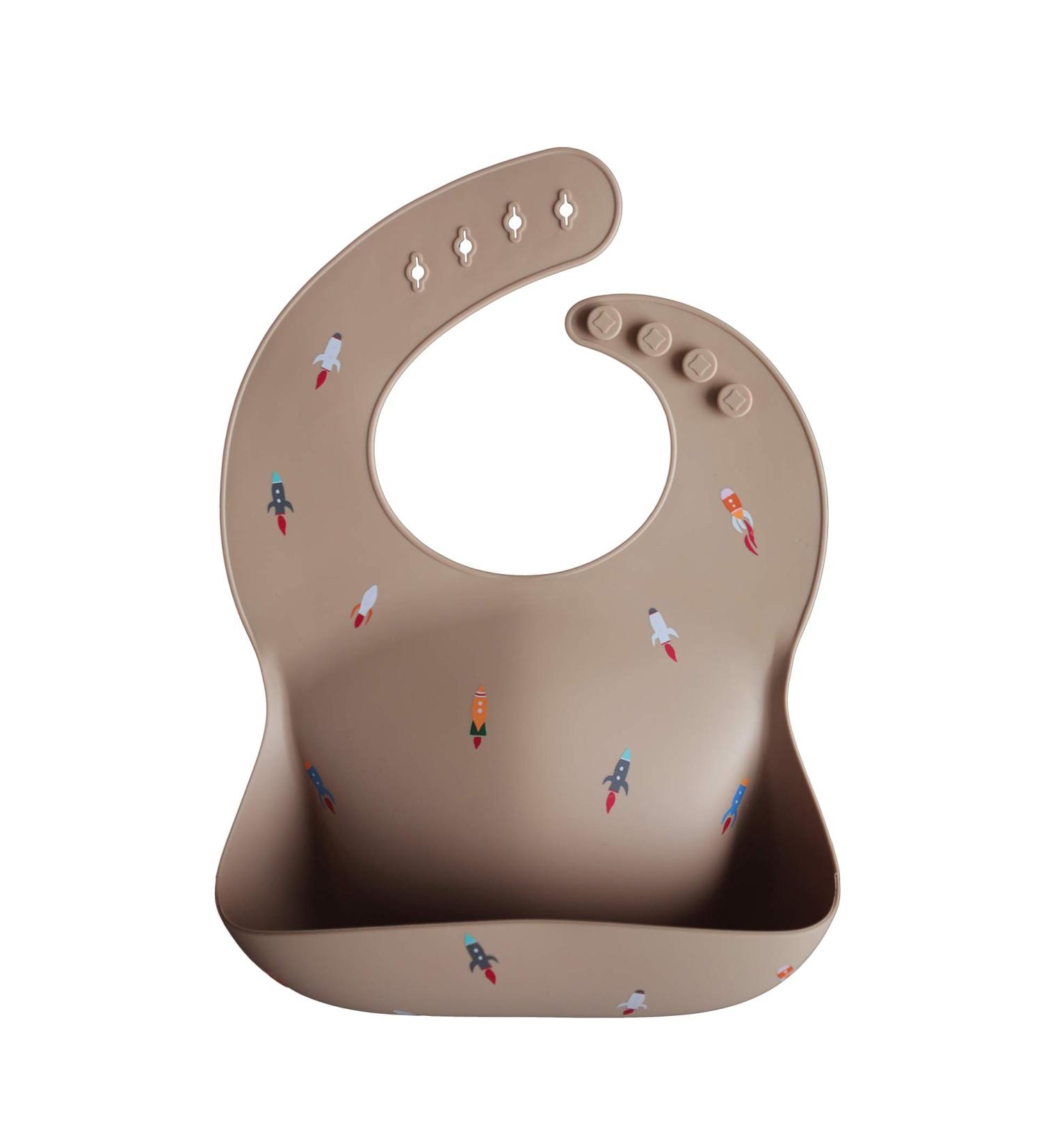 Mushie Baby Silicone Bib | Adjustable Waterproof Feeding Bib with Deep Pockets | BPA-Free Rocket Design - Buy Online on GoSupps.com