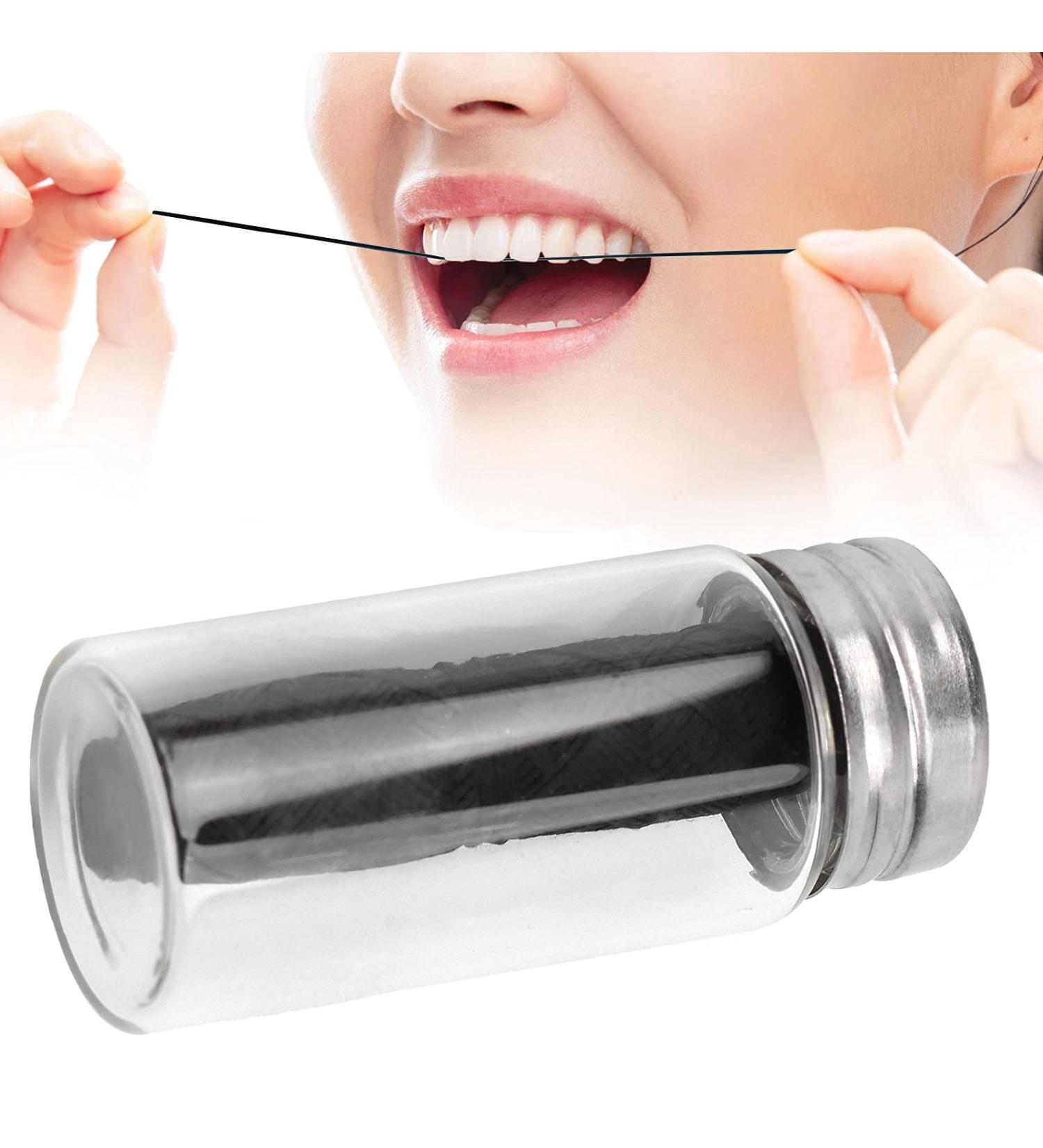 Portable Black Dental Floss with Refillable Container - Nature Tooth Flap & Plaque Removal | Shop Internationally - Buy Online on GoSupps.com