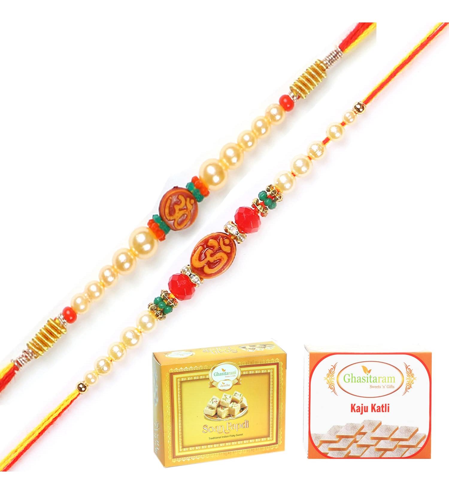 Ghasitaram Gifts Rakhi for Brother Rakhis Online - Set of 2 6135 6276 Om Pearl Rakhi Threads with 200 GMS of Kaju katli and 200 GMS of Soan Papdi - Buy Online on GoSupps.com