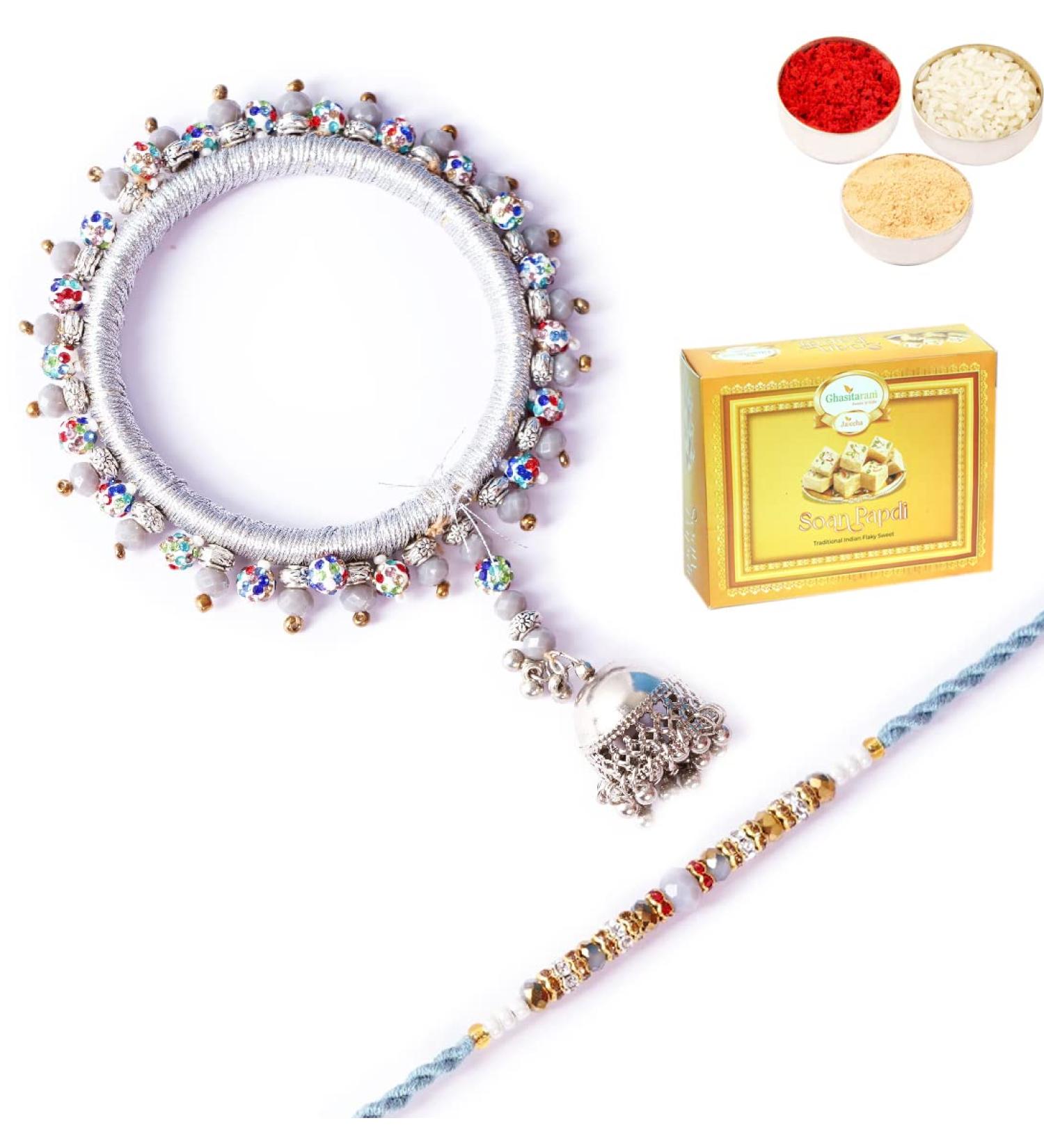 Ghasitaram Gifts Rakhis Online - Rakhi for Brother-RM-262 Bhaiya Bhabhi Rakhi with 200 GMS of Soan Papdi Rakhi Set with 200 gms of Soan Papdi - Buy Online on GoSupps.com