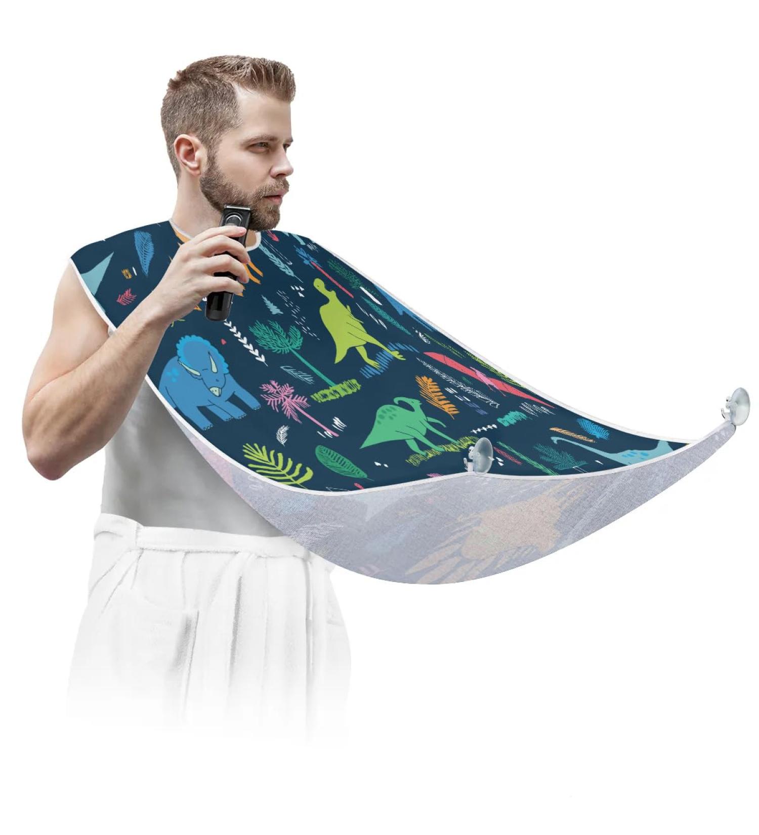 Beard Bib Apron for Men | Waterproof Hair Catcher & Grooming Cape with Colorful Dinosaurs - Perfect for Shaving & Trimming - Buy Online on GoSupps.com