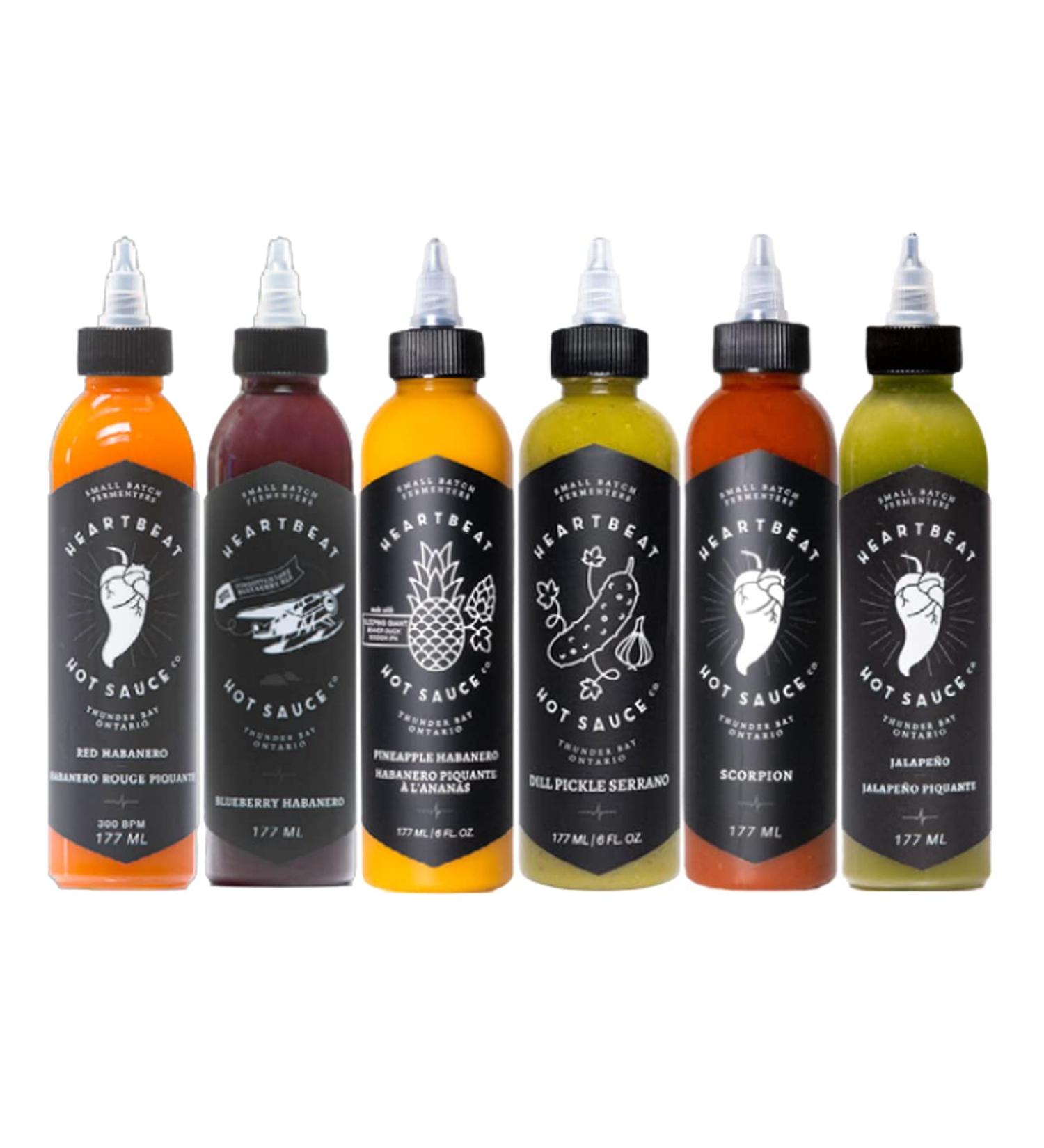 Heartbeat Hot Sauce - Ultimate 6-Pack 2.0 (1 x 177ml Red Habanero 1 x 177ml Green Jalapeno 1 x 177ml Blueberry Habanero 1 x 177ml Pineapple Habanero 1 x 177ml Scorpion 1 x 177ml Dill Pickle Serrano) - Buy Online on GoSupps.com