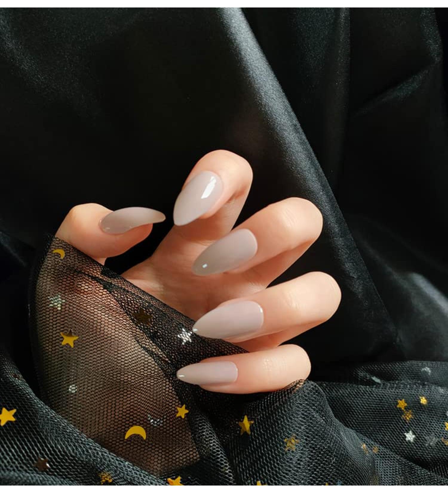 Justotry 24 pieces glossy solid stiletto nails for sticking out medium nude French press on nails simply almond art nail fake nails short with glue fingernails artificial nails for women nude & solid 1