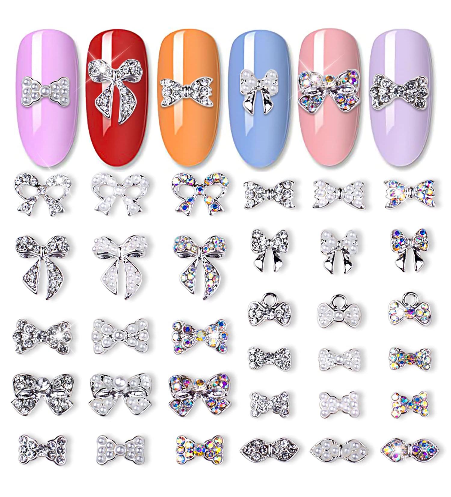 JERCLITY 33 Pcs Silver Alloy Bow Nail Charms - Iridescent Rhinestone & Pearl Nail Art Studs for Women & Girls - Buy Online on GoSupps.com