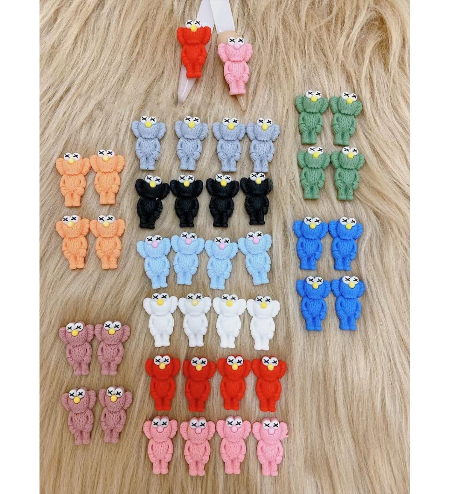 KAWS Nail Charms 4pcs - Mixed Green Pink | Add a touch of art to your nails - Buy Online on GoSupps.com