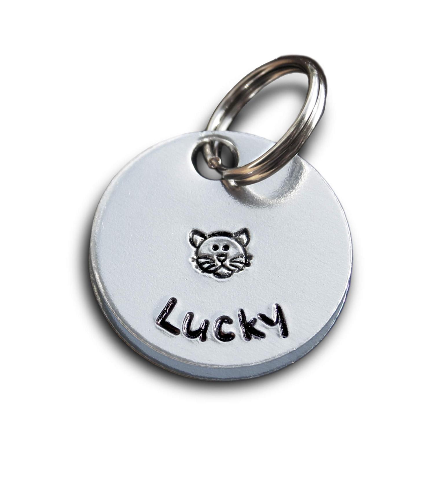 Personalised Cat Tag. Put your cat's name on an aluminium round disc featuring a hand-stamped cat. Pet Id Tag. Pet Name Tag. - Buy Online on GoSupps.com