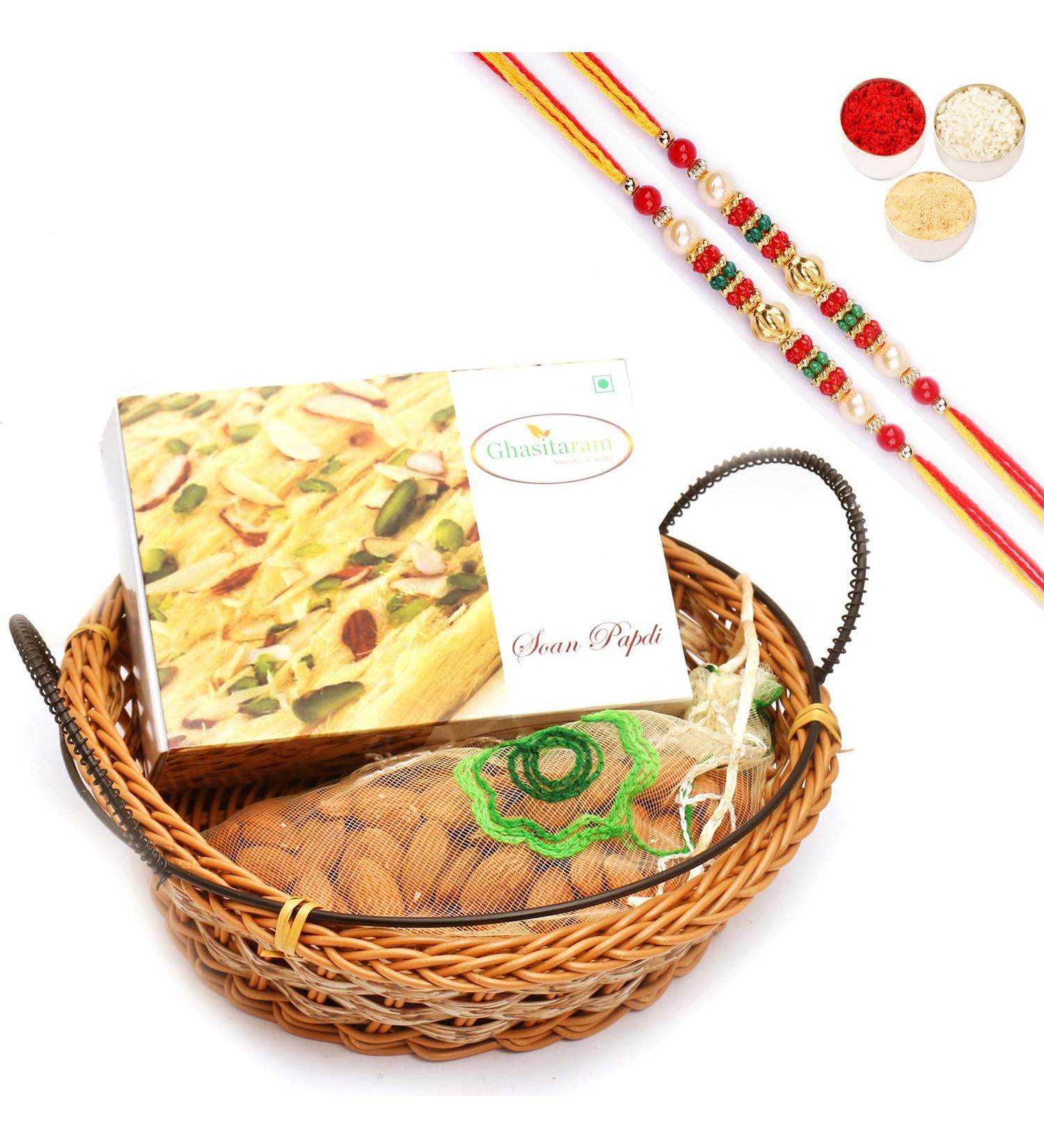 Ghasitaram Gifts Rakhi Gifts for Brothers Rakhi Sweets - Small Cane Basket with Soan Papdi and Almonds Pouch with 2 Pearl Beads Rakhis Basket with Soan Papdi and Almonds with 2 Rakhis - Buy Online on GoSupps.com