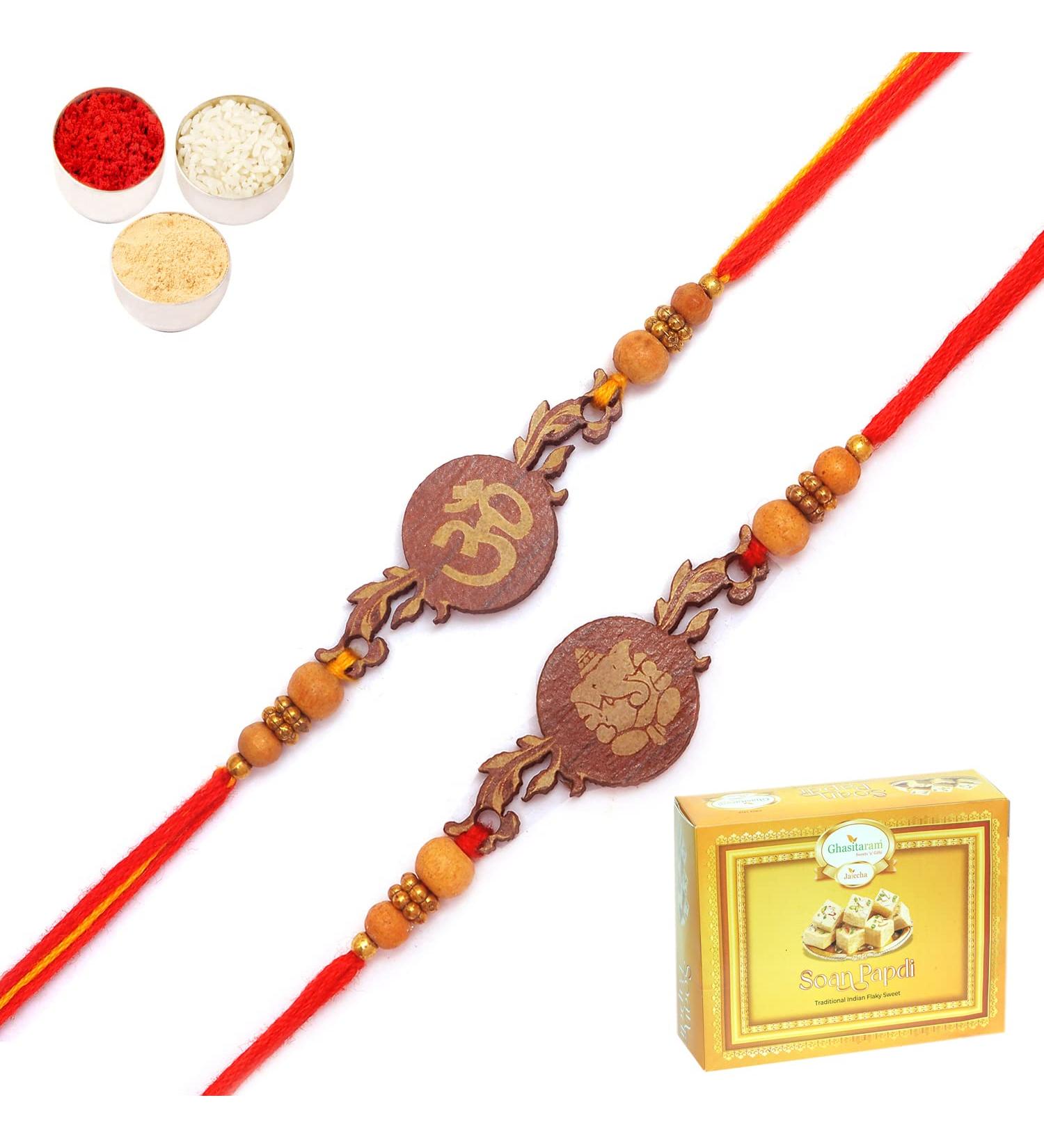 Ghasitaram Gifts Rakhi for Brother Rakhis Online - Set of 2 BW-5410 and BW-5414 Om Ganesh Divine Rakhis with 200 GMS of Soan Papdi - Buy Online on GoSupps.com