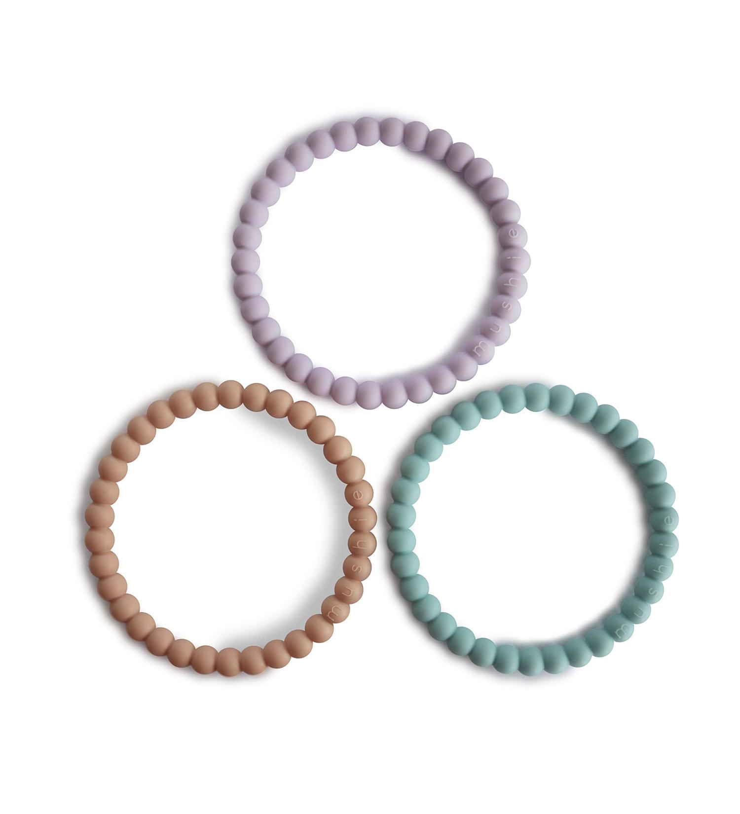 Mushie Pearl Bite Ring Bracelets - 3-Pack Dental Aid for Kids | Safe BPA-Free Teething Toys for Babies & Toddlers | Lilac Cyan & Soft Peach - Buy Online on GoSupps.com