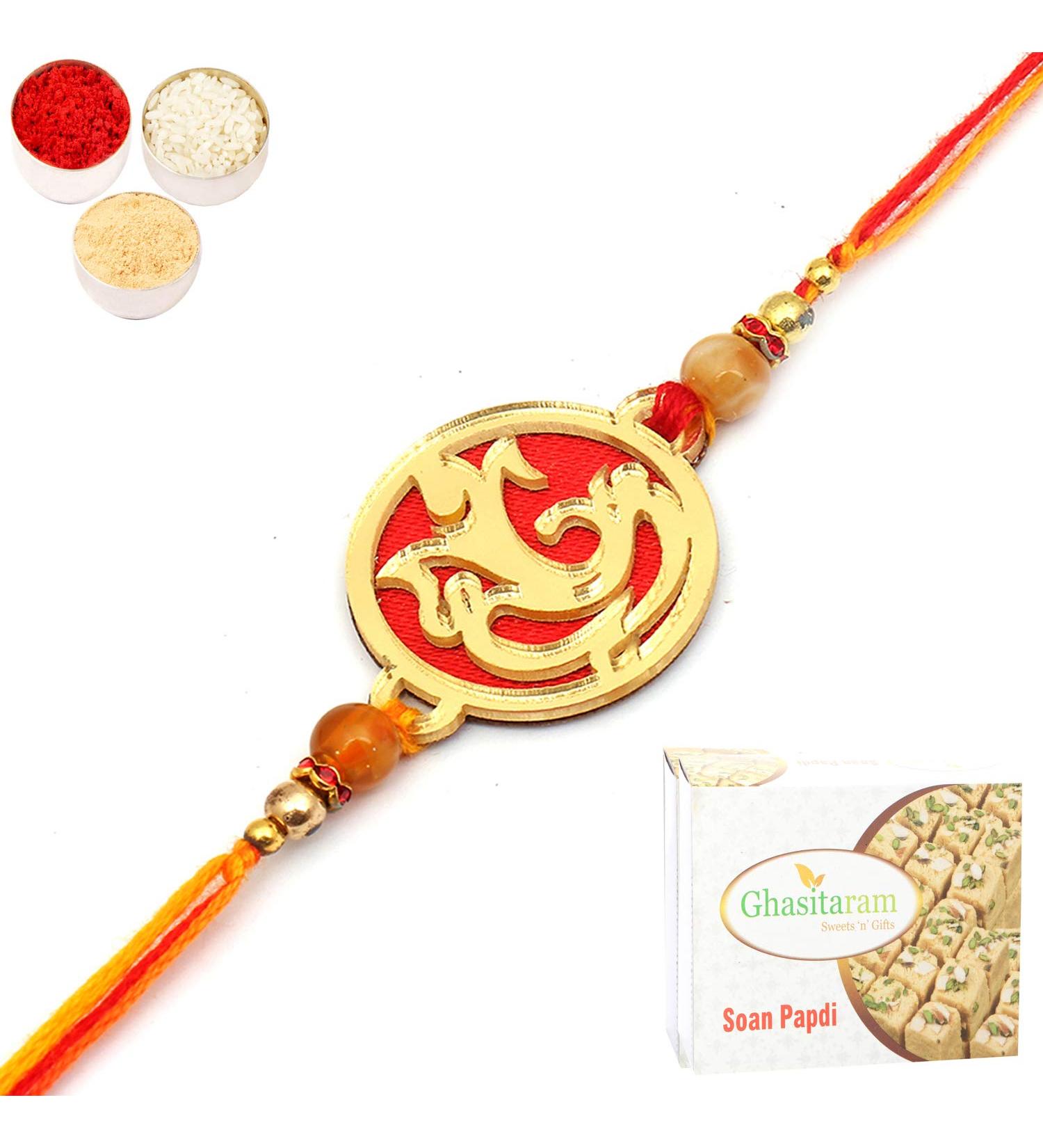 Ghasitaram Gifts Rakhi for Brother Rakhis Online- Aura of Ganesha caaa6 Rakhi with 200 GMS of Soan Papdi - Buy Online on GoSupps.com