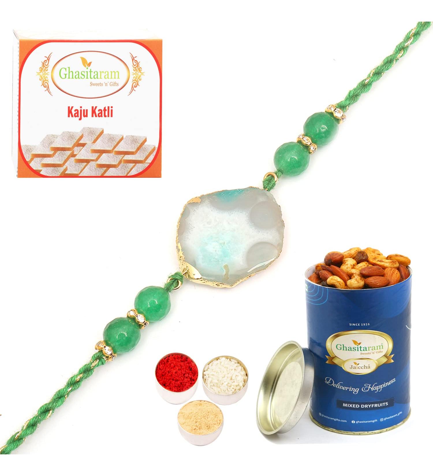Ghasitaram Gifts Rakhi for Brother Rakhis Online - RM591 - Blue Stone Bracelet Rakhi with 100 GMS of Dryfruits Mix Can 200 GMS of Kaju katli Rakhi & 100g Dryfruits Mix Can 200g Kaju katli - Buy Online on GoSupps.com