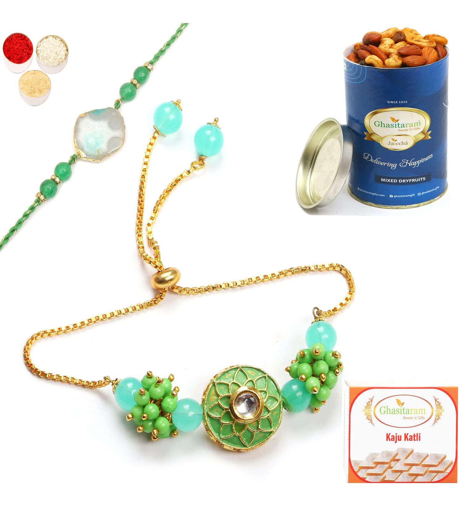 Ghasitaram Gifts Rakhis Online - Rakhi for Brother-T-12 Green Stone Bhaiya Bhabhi Rakhi with 100 GMS of Dryfruits Mix Can 200 GMS of Kaju katli Rakhi Set & 100g Dryfruits Mix Can 200g Kaju katli - Buy Online on GoSupps.com