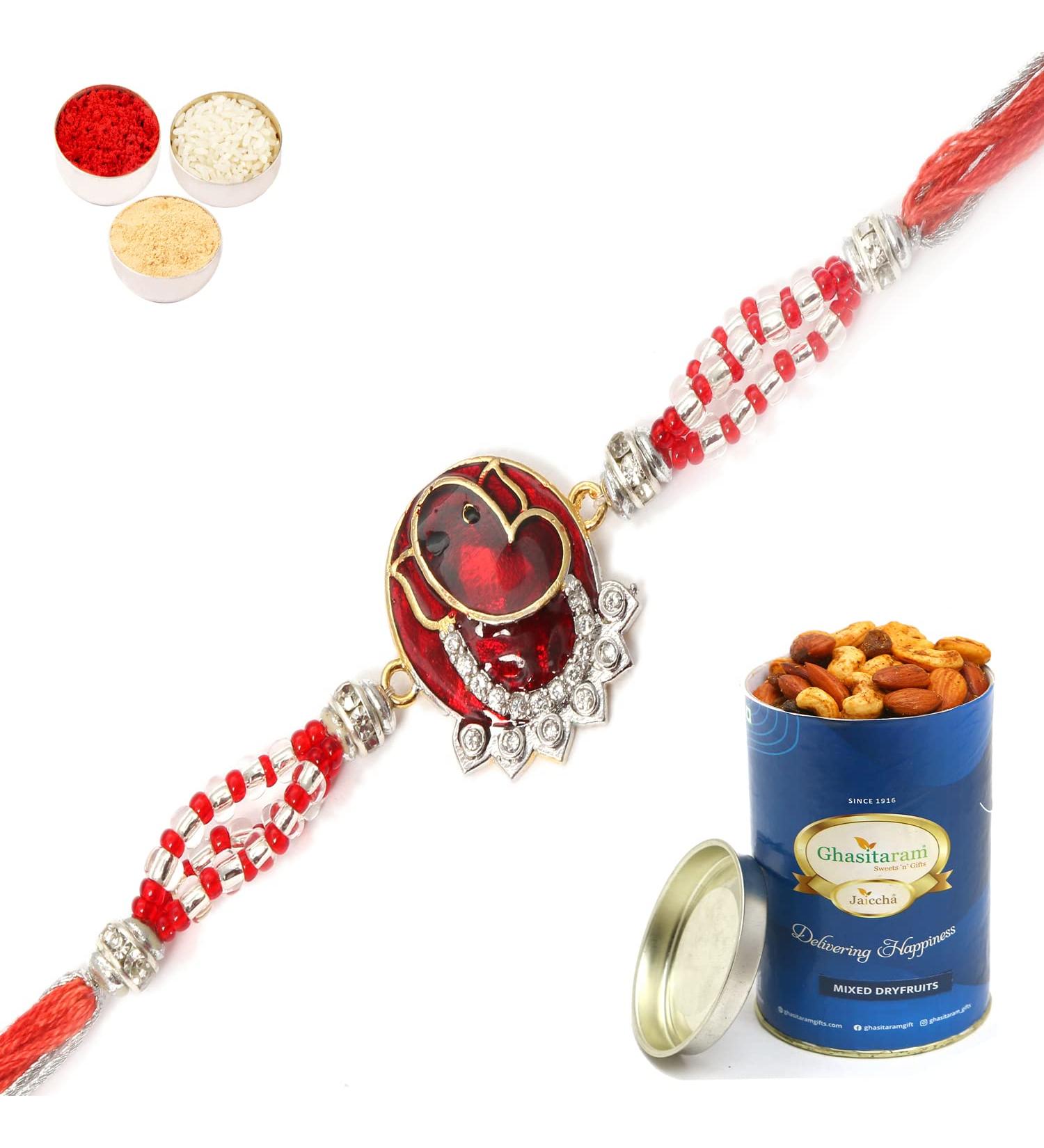 Ghasitaram Gifts Rakhi for Brother Rakhis Online - 7317 Red Sapphire Ganesha Rakhi with 100 GMS of Dryfruits Mix Can Rakhi Set with 100 gms of Dryfruits Mix Can - Buy Online on GoSupps.com