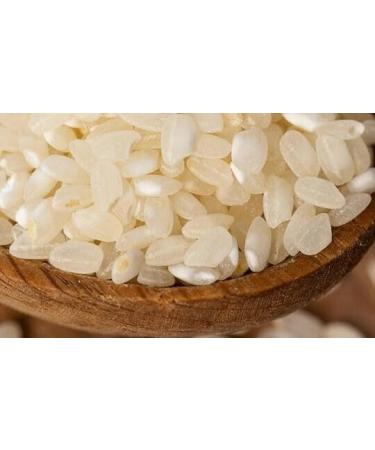 Divella Original Rice - Lot of 5 grains of round rice - Italian rice - Id al for traditional recipes - Packaging sous vide of 1 kg + 1 packet of talc powder Felce Azzurra - Sachet of 100 - Buy Online on GoSupps.com