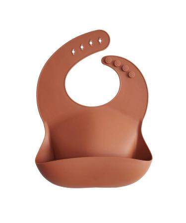 Mushie Baby Silicone Bib | Adjustable Fit Waterproof Bibs | Easy Wipe Baby Feeding Bibs | 4 Adjustable Sizes with Deep Front Pockets | 100% BPA and Phthalate Free Clay