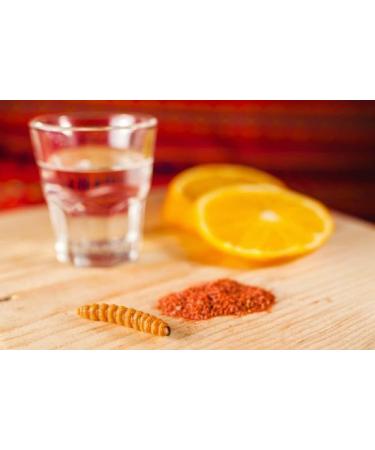 Elegant and stylized glass bottle with salt worm for mezcal from Mexico - Buy Online on GoSupps.com