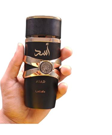 Bundle of Lattafa Asad 3.4oz Eau de Parfum with 5ml Portable Refillable Atomizer and Refillable Car Freshener in a Satin Gift Bag - Buy Online on GoSupps.com