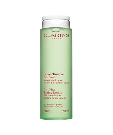 Clarins Purifying Toning Lotion | Less Oily Skin After 14 Days of Use* | Cleanses Hydrates Purifies Mattifies and Balances Skin's Microbiota | Contains Witch Hazel | Combination To Oily Skin Types 6.7 Fl Oz (Pack of 1)