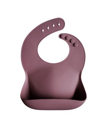 Mushie Baby Silicone Bib | Adjustable Fit Waterproof Bibs | Easy Wipe Baby Feeding Bibs | 4 Adjustable Sizes with Deep Front Pockets | 100% BPA and Phthalate Free Dusty Rose