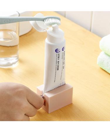 4PCS Toothpaste Dispenser & Seat Holder | Manual Rotation Squeezer - Save on Toothpaste, Cosmetics & Skin Care Products | Pink, White, Light Blue, Dark Blue - Buy Online on GoSupps.com