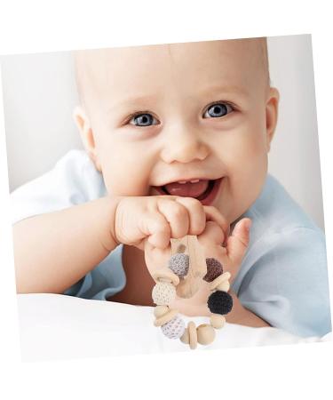 KOMBIUDA Silicone & Wooden Baby Teether Maracas | Musical Instruments & Teething Toy for Babies 0-6 Months - Buy Online on GoSupps.com