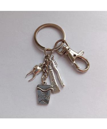 Shop Ancient Silver Toothpaste Keychain - Unique Toothbrush Keyring & Floss Charm Pendant for Travel | Perfect Gift - Buy Online on GoSupps.com