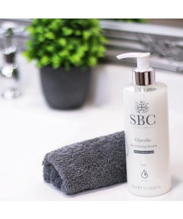 SBC Skincare Glycolic Resurfacing Serum - 300ml | 5% Glycolic Acid Serum For Dry Congested Skin | Vegan Friendly Body Serum | Exfoliating Serum For Ingrown Hairs - Buy Online on GoSupps.com
