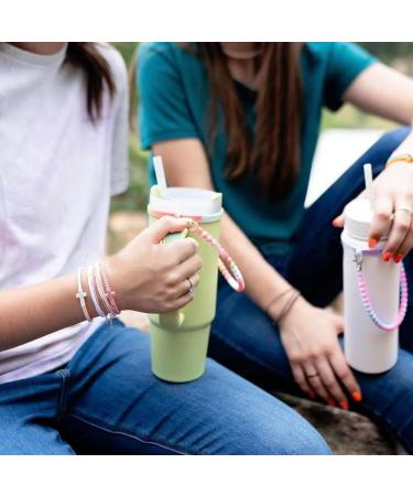 Portable Body Silicone Water Bottle Holder - Carriage Strap & Kettle Keeper for Camping Hiking & Outdoor Activities - Pink Yellow & White - Buy Online on GoSupps.com