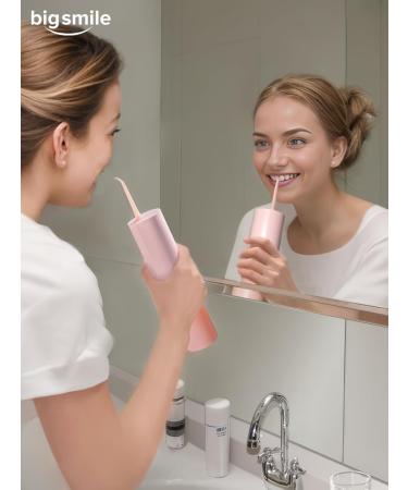 Bigsmile Pink Mini Water Flosser - Cordless Oral Irrigator for Kids Travel & Shower Use | Magnetic Wireless Charge | Dentist Recommended - Buy Online on GoSupps.com