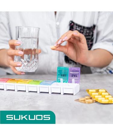 Sukuos Large Weekly Pill Organizer - 7 Day Portable Pill Box for Medications Vitamins & Supplements | Easy Push Button Rainbow Design - Buy Online on GoSupps.com