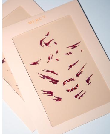 Shop Blood Splat Face Jewels | Mercy London Vampire Costume Accessories | Sticky Face Gems Headpiece - Buy Online on GoSupps.com