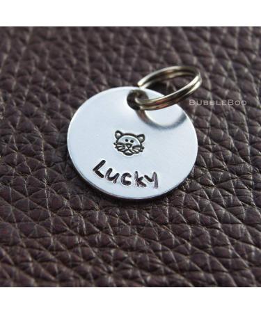 Personalised Cat Tag. Put your cat's name on an aluminium round disc featuring a hand-stamped cat. Pet Id Tag. Pet Name Tag. - Buy Online on GoSupps.com