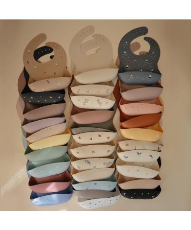 Mushie Baby Silicone Bib | Adjustable Waterproof Feeding Bib with Deep Pockets | BPA-Free Rocket Design - Buy Online on GoSupps.com