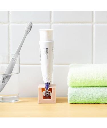 4PCS Toothpaste Dispenser & Seat Holder | Manual Rotation Squeezer - Save on Toothpaste, Cosmetics & Skin Care Products | Pink, White, Light Blue, Dark Blue - Buy Online on GoSupps.com