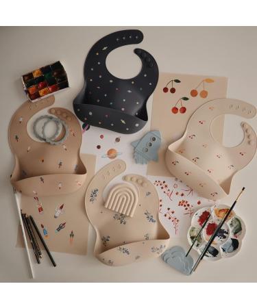 Mushie Baby Silicone Bib | Adjustable Waterproof Feeding Bib with Deep Pockets | BPA-Free Rocket Design - Buy Online on GoSupps.com