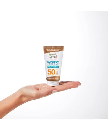 Garnier Ambre Solaire Super UV Face Protective Anti-aging Face Cream with Hyaluronic Acid SPF 50 - Buy Online on GoSupps.com