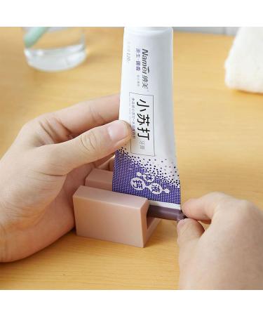 Lazy People Toothpaste Dispenser Silica Gel Bottom Roller Space Saving Squeezing Cream Tube Squeezing Dispenser 1 Piece Pink - Buy Online on GoSupps.com