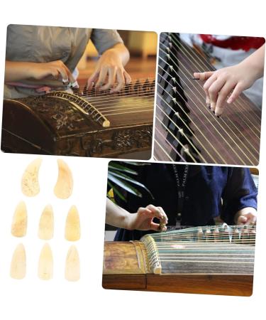 POPETPOP 8pcs Guzheng nails music thumb pick ox horn pick picks for guitar ukulele pick horn guitar pick guzheng picks bass guitar picks Durable Guzheng Supplies child horns trumpet aldult 3X1.2X0.1CM Light Yellow 01 - Buy Online on GoSupps.com