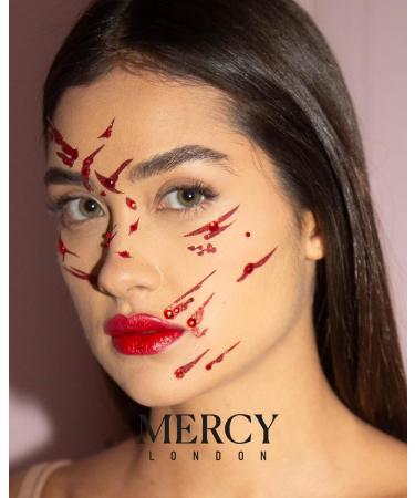 Shop Blood Splat Face Jewels | Mercy London Vampire Costume Accessories | Sticky Face Gems Headpiece - Buy Online on GoSupps.com