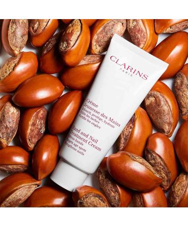 Clarins Hand and Nail Treatment Cream | Award-Winning Formula | Softens, Nourishes, and Shields Skin | Strengthens Nails, Conditions Cuticles | Shea Butter & Natural Plant Extracts | 3.4 oz - Buy Online on GoSupps.com