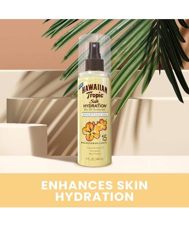 Hawaiian Tropic Weightless Hydration Dry Oil Sunscreen Mist SPF 15 made with a blend of coconut argan grapeseed and olive oils for 12 hours of moisturization 5oz - Buy Online on GoSupps.com