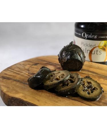 Opies Pickled Walnuts 390 g Harvested before shell formulation cooked & marinated in a special malt vinegar. Serve with cheese cold meats or as an ingredient in casseroles & salads. - Buy Online on GoSupps.com